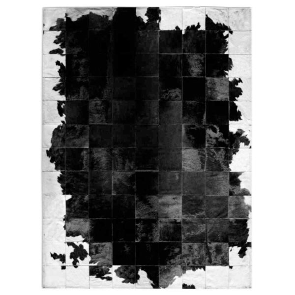 Pasión del tango: Patchwork carpet from black and white cowhide