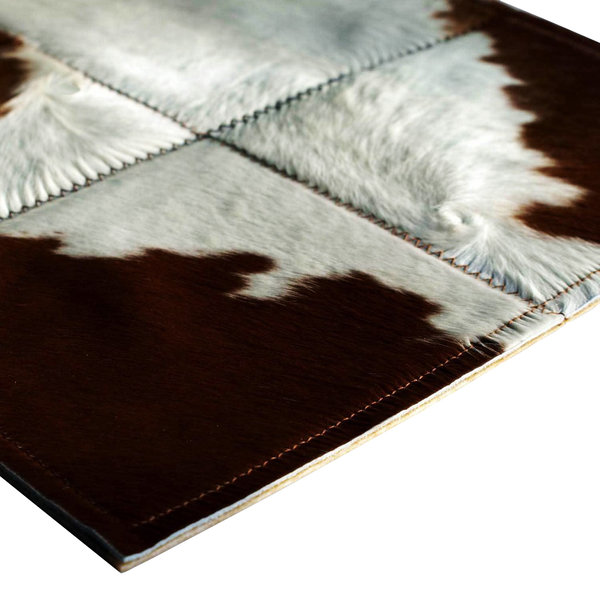 Cinnamon and sugar: Patchwork carpet from brown and white cowhide